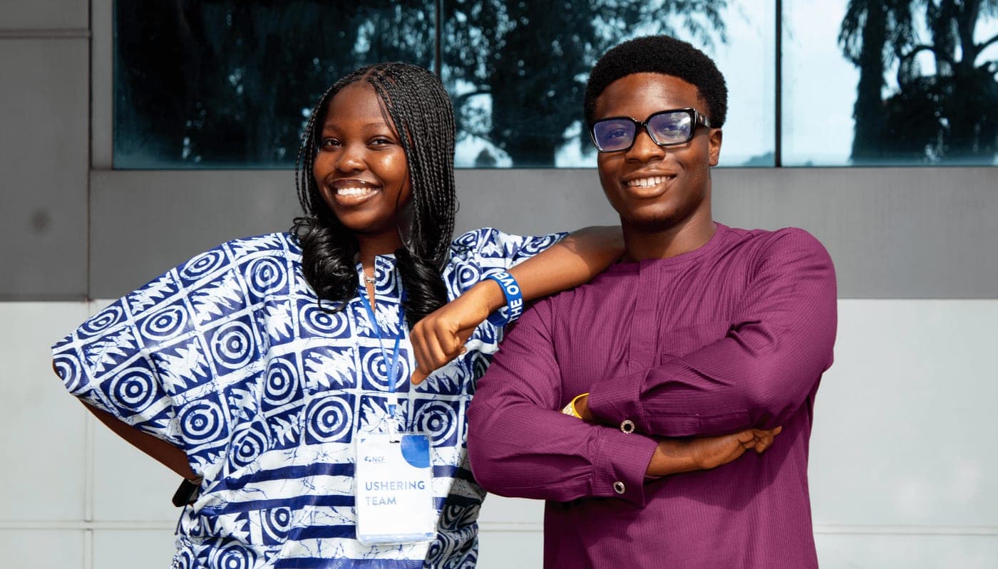 Two students in conversation after a fellowship service